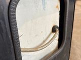a close up of a metal door with a handle on it