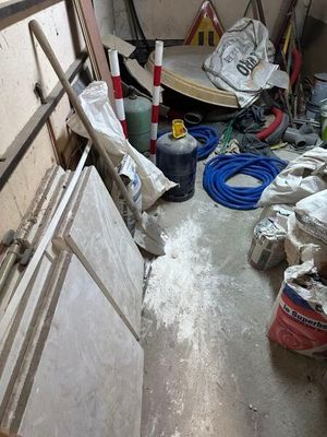 an image of a room with a lot of stuff on the floor