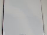 a white sheet of paper with a barcode on it sitting on a table