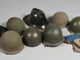 a lot of helmets that are sitting on a table