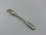 a fork and a spoon on a white surface