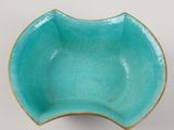 an image of a blue bowl sitting on top of a white table