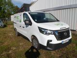a white van parked in front of a building