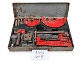 a box with tools in it on a white surface