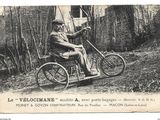 a black and white photo of a man riding a motorcycle