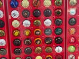 many different types of buttons in a red box