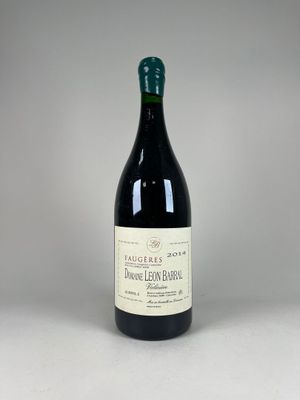 a close up of a bottle of wine on a table
