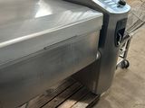 a machine that is sitting on a pallet in a warehouse