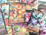 a lot of pokemon cards that are on the table