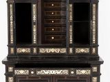 a black and white cabinet with a mirror on top of it