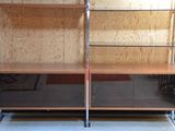two bookshelves that are made of wood and metal