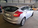 a silver car that is parked in a garage