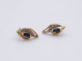 a pair of sapphire and diamond earrings