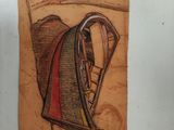 painting of a man sitting in a chair with a ladder in front of him