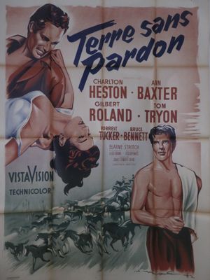 une vieille affiche de cinéma représentant un homme et une femme à cheval