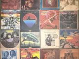 the album covers of various albums are displayed on a wall