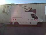 a white utility truck parked in front of a building