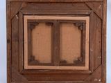 an old picture frame with a picture of a window in it