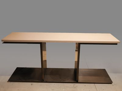 a table with a metal base and a wooden top