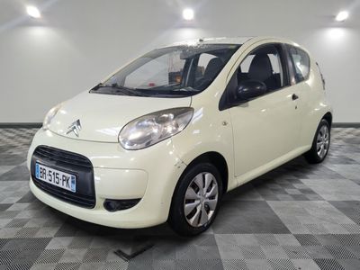 a picture of a small white car on a checkered floor