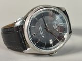 a close up of a watch on a table