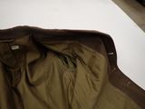 a close up of a jacket on a white table