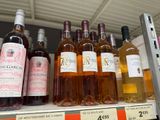 many bottles of wine on the shelf in the store