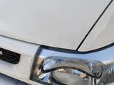 a close up of the front of a white truck