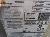 a label on the back of a refrigerator that says taylor