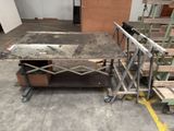 a table that is sitting on a cart in a room