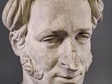 marble bust of a man with a beard and a moustache