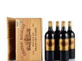 three bottles of wine in a wooden box with a wooden box behind them