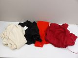 a pile of clothes sitting on a white table
