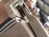 a close up view of a refrigerator in a warehouse