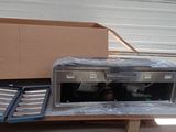 a microwave sitting on top of a table in a garage
