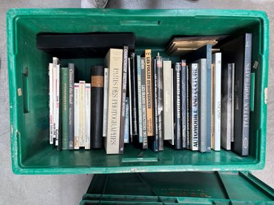 a green box filled with books on top of a table