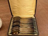 a case with spoons in it on a table