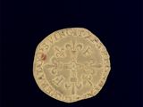 une pièce d'or sur laquelle est représentée une croix