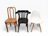 three chairs sitting next to each other on a white surface