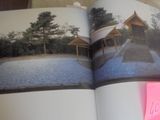a picture of a book with a picture of a house in it