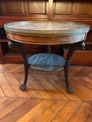 an image of a round table with a wooden top on a wooden floor