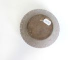a bowl with a tag on it sitting on a table