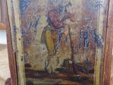 an old picture of a man on a horse is on a chair