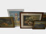 five framed pictures on the wall of a room