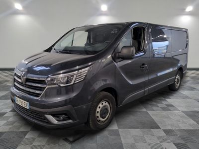 the grey van is parked on a checkered floor in a room
