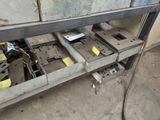 an image of a metal work bench with a lot of tools