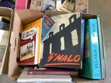 a box full of books that are sitting on the floor