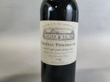 a bottle of wine that is sitting on a table