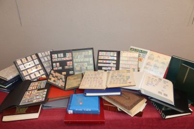 a lot of books on a table with a red table cloth