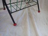 a toy basket that is sitting on a white sheet